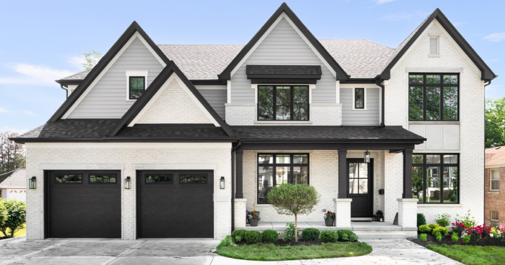 black garage doors on white house